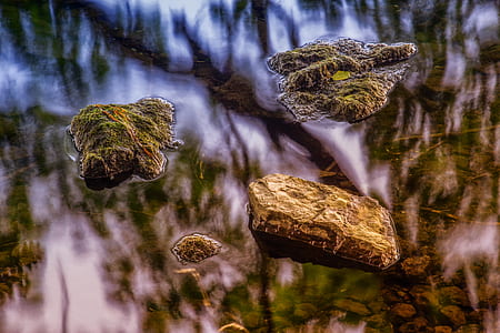 selective focus photo of a four brown stones thumbnail