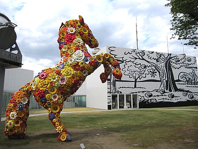floral horse statue near tree graffiti thumbnail