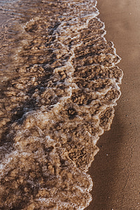 Soft wave of the sea on the sandy beach thumbnail