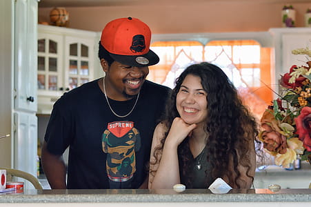 Woman and Man Standing In-front of Gray Table thumbnail