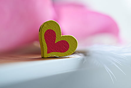 shallow focus photography of yellow and pink heart ornament thumbnail