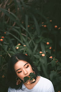 Woman Biting Green Leaf thumbnail