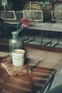 Close-up Photography of Mug and Flower Vase thumbnail