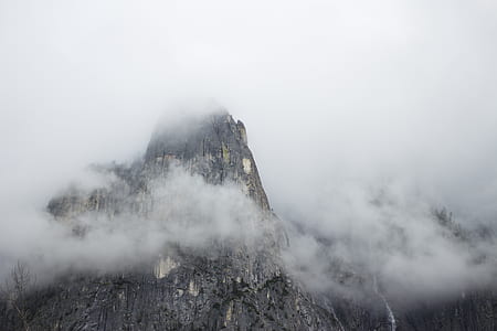 mountain under cloudy sky during day time thumbnail