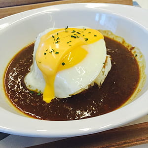 sunny side up egg with cheese in oval white ceramic plate thumbnail