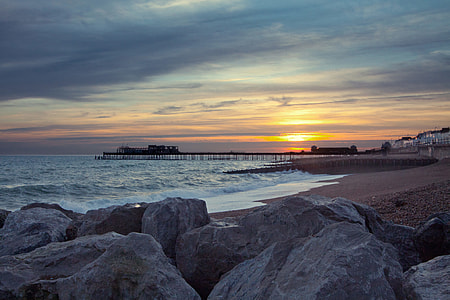 Wide angle shot taken at sunset of the pier and seafront at Hastings, East Sussex, England thumbnail