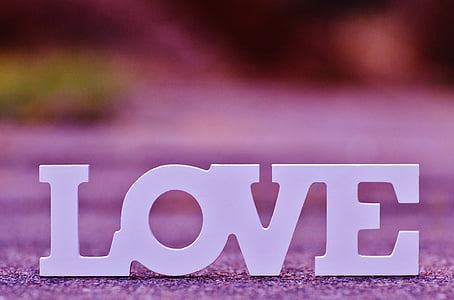white freestanding letters on gray concrete surface at daytime thumbnail