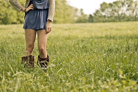 woman standing on grass field thumbnail