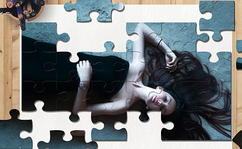 woman wearing black dress-themed jigsaw puzzle thumbnail
