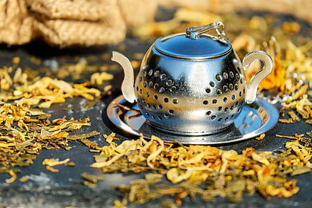 stainless steel pitcher and yellow flowers thumbnail