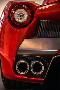 close-up photo of red sports coupe taillight thumbnail