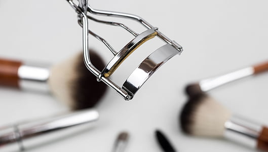 closeup photo of false eyelash curler thumbnail