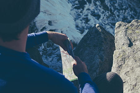 man sitting on cliff thumbnail