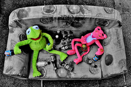 green Kermit the Frog and Pink Panther plush toy on sofa thumbnail