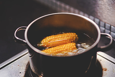 dutch oven filled with water and corn thumbnail