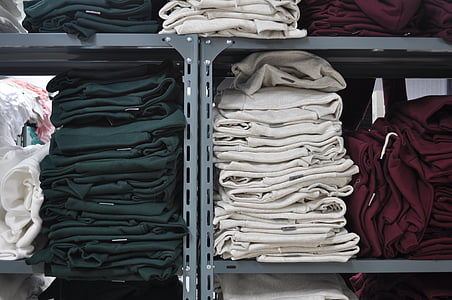pile of folded clothes on shelf thumbnail