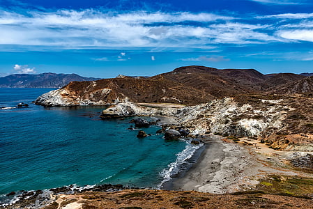 landscape photography of mountain beside ocean thumbnail