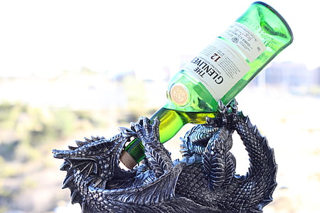 gray dragon bottle holder with green translucent glass beverage bottle thumbnail