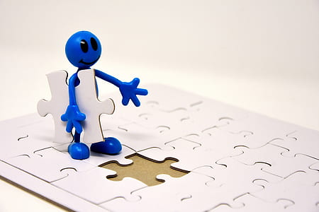 blue character holding jigsaw puzzle thumbnail