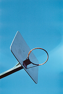 basketball hoop under blue sky thumbnail