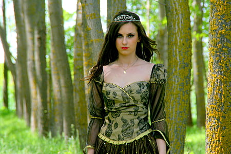 woman wearing medieval dress standing beside tree thumbnail