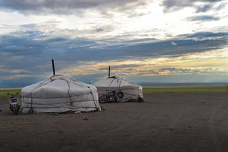 two white tents beside motocycles thumbnail
