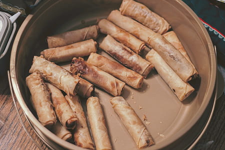 spring rolls on brown pot thumbnail
