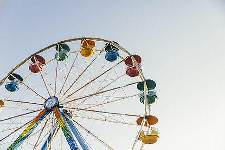 multicolored ferris wheel under gray sky thumbnail