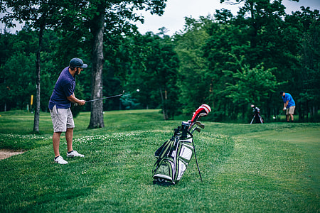 man playing golf during daytime thumbnail