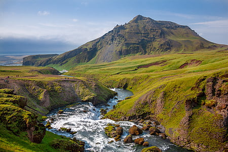 aerial photography of mountain near body of water thumbnail