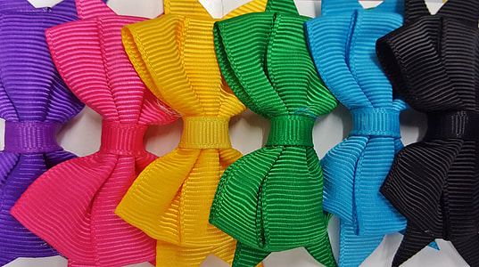 six assorted-color bow ties on white surface thumbnail