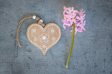 brown heart wooden decor near pink flower thumbnail