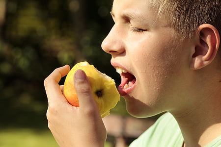 boy eating apple fruit thumbnail