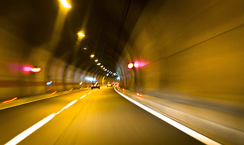 timelapse photography of cars inside tunnel thumbnail