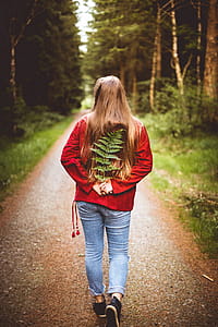 Woman Holding Leaves on Her Back thumbnail
