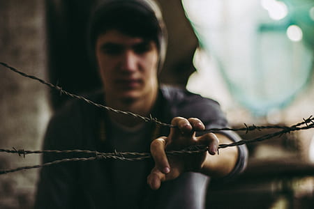 man holding wire thumbnail