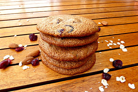 stack of five cookies on top brown wooden surface thumbnail