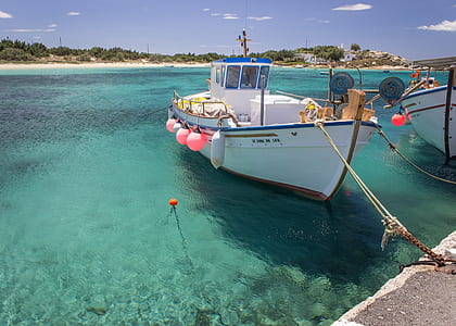 white fishing vessel in dock thumbnail