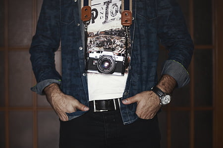 man wearing blue denim jacket and black pants doing pose thumbnail