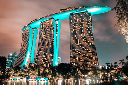 gray concrete building with yellow lights thumbnail