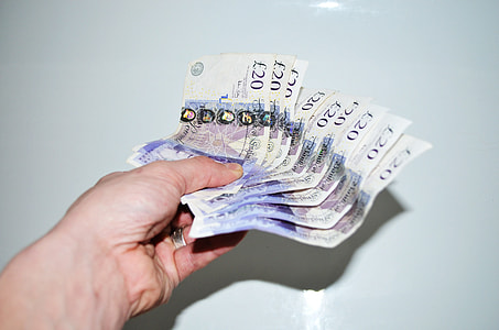 person holding 20 Euro banknotes thumbnail