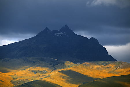 mountain under cloudy sky thumbnail