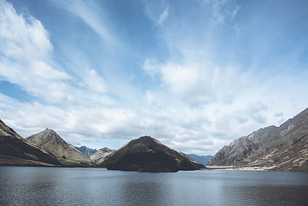 body of water near mountains thumbnail