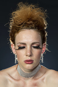 woman wearing silver-colored necklace thumbnail