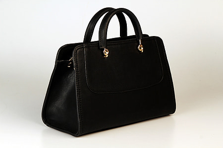 black leather handbag on white surface thumbnail