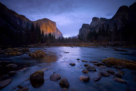 rocks in water near mountain thumbnail