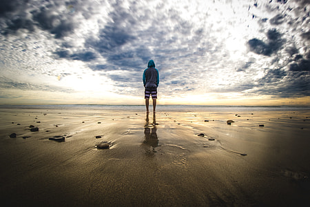 person standing on sand thumbnail
