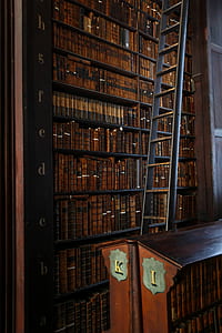 black wooden ladder near pile of books thumbnail