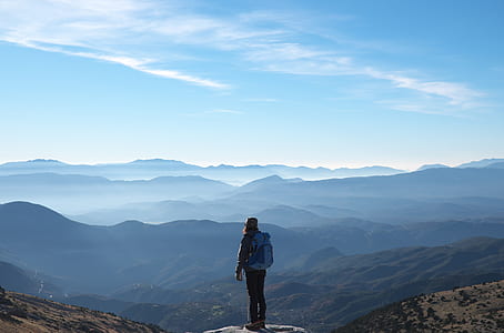 person standing on top of the mountain thumbnail