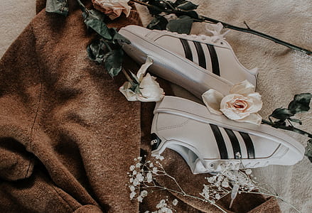 pair of white adidas low-top sneakers with white roses thumbnail